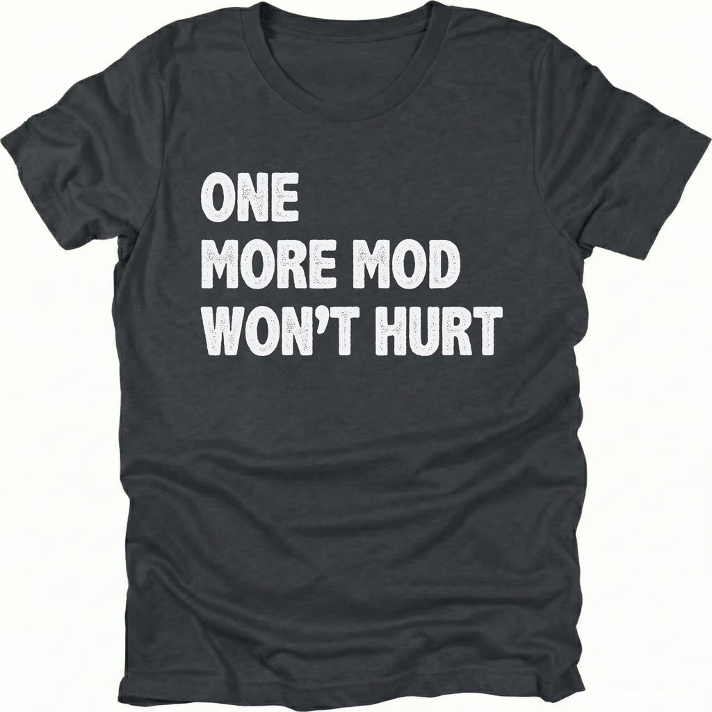 Black T-Shirt with bold white “One More Mod Won’t Hurt” text shown on front view by Trail Snark.