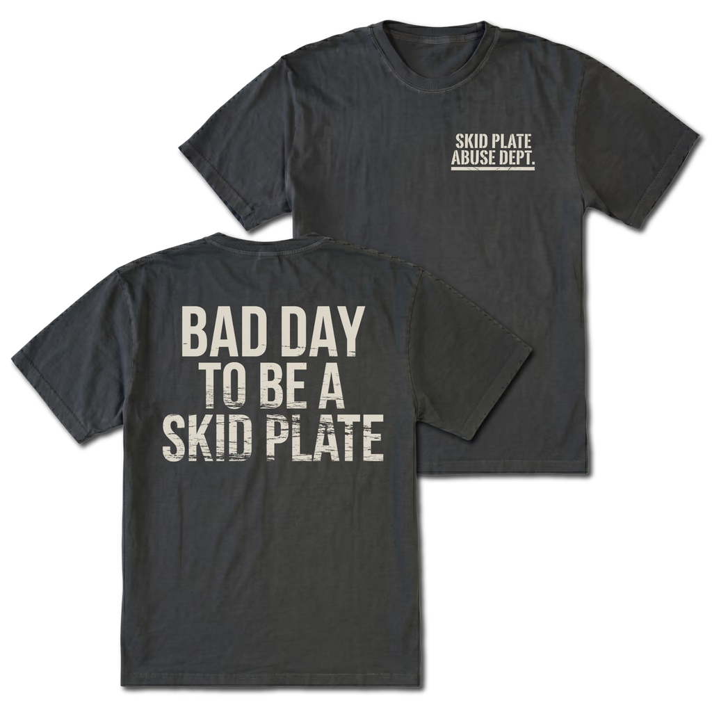 Black T-shirt with Bad Day To Be A Skid Plate back design and Skid Plate Abuse Dept. front chest print by Trail Snark.