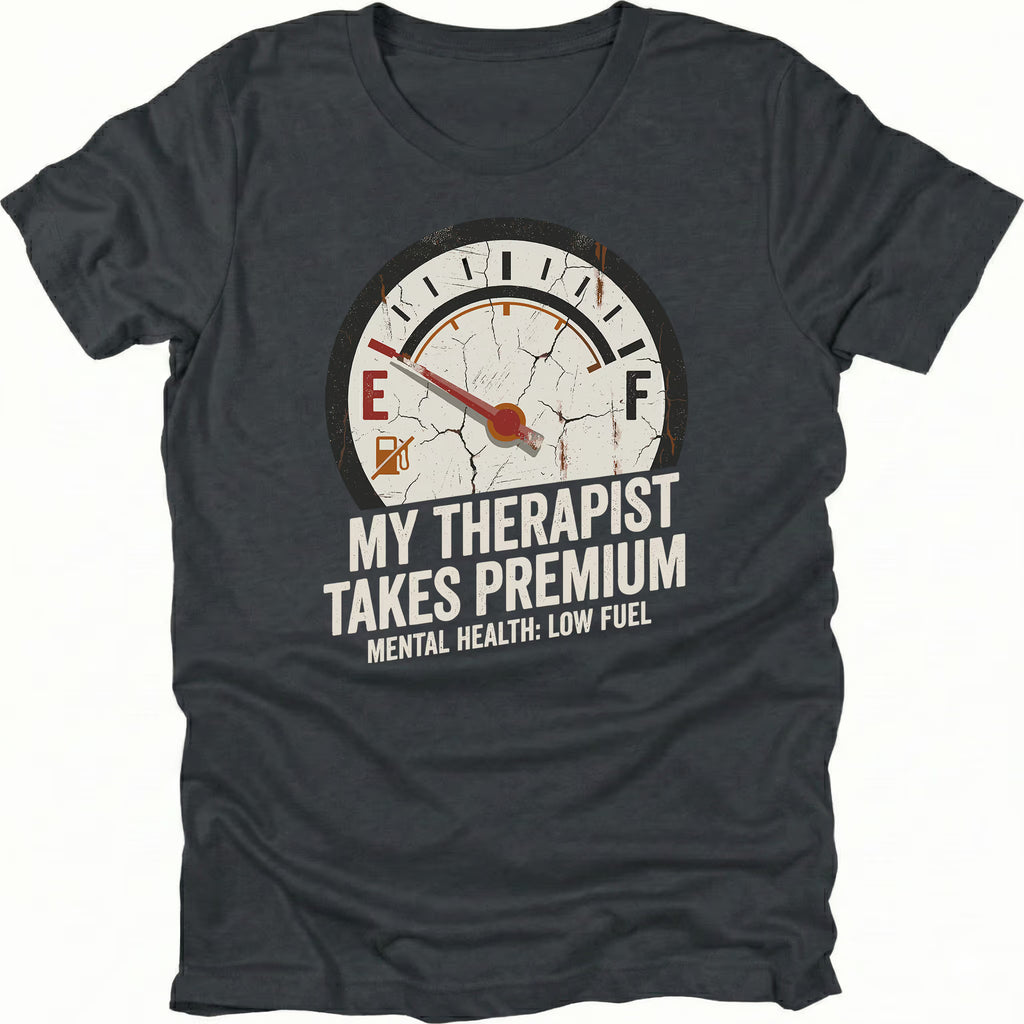 Black t-shirt with distressed fuel gauge graphic pointing near empty and text reading My Therapist Takes Premium with Mental Health Low Fuel by Trail Snark.