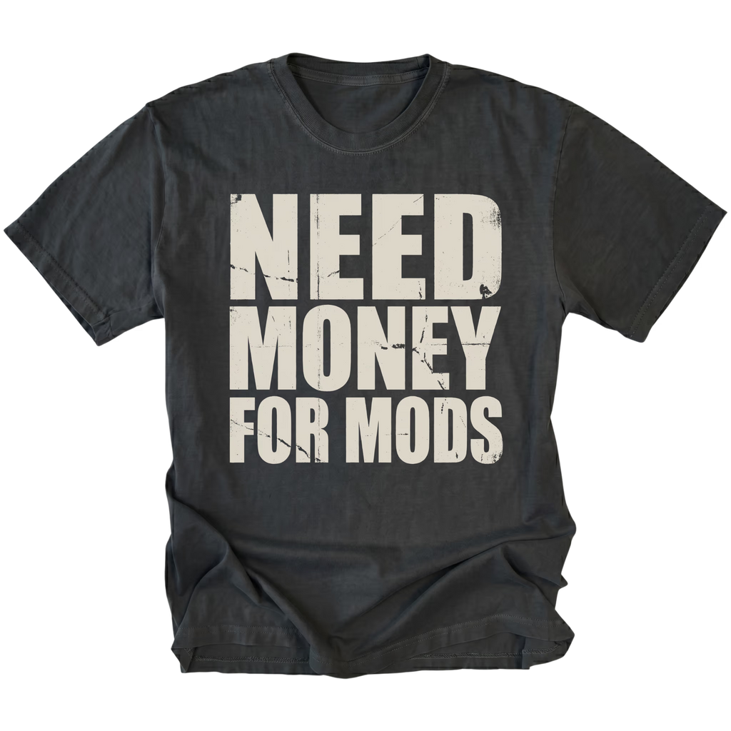 Black t-shirt with large distressed white text reading Need Money For Mods in bold block lettering.