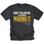 Black T-shirt featuring the Barely Making It recovery hook design on the front by Trail Snark.