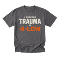 A charcoal gray crewneck t-shirt with a graphic text print reading 'I PROCESS TRAUMA IN 4-LOW' in cream and orange lettering, displayed on a solid white background.