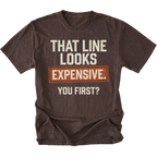 A dark brown graphic t-shirt with the text 'THAT LINE LOOKS EXPENSIVE. YOU FIRST?' printed on the front.