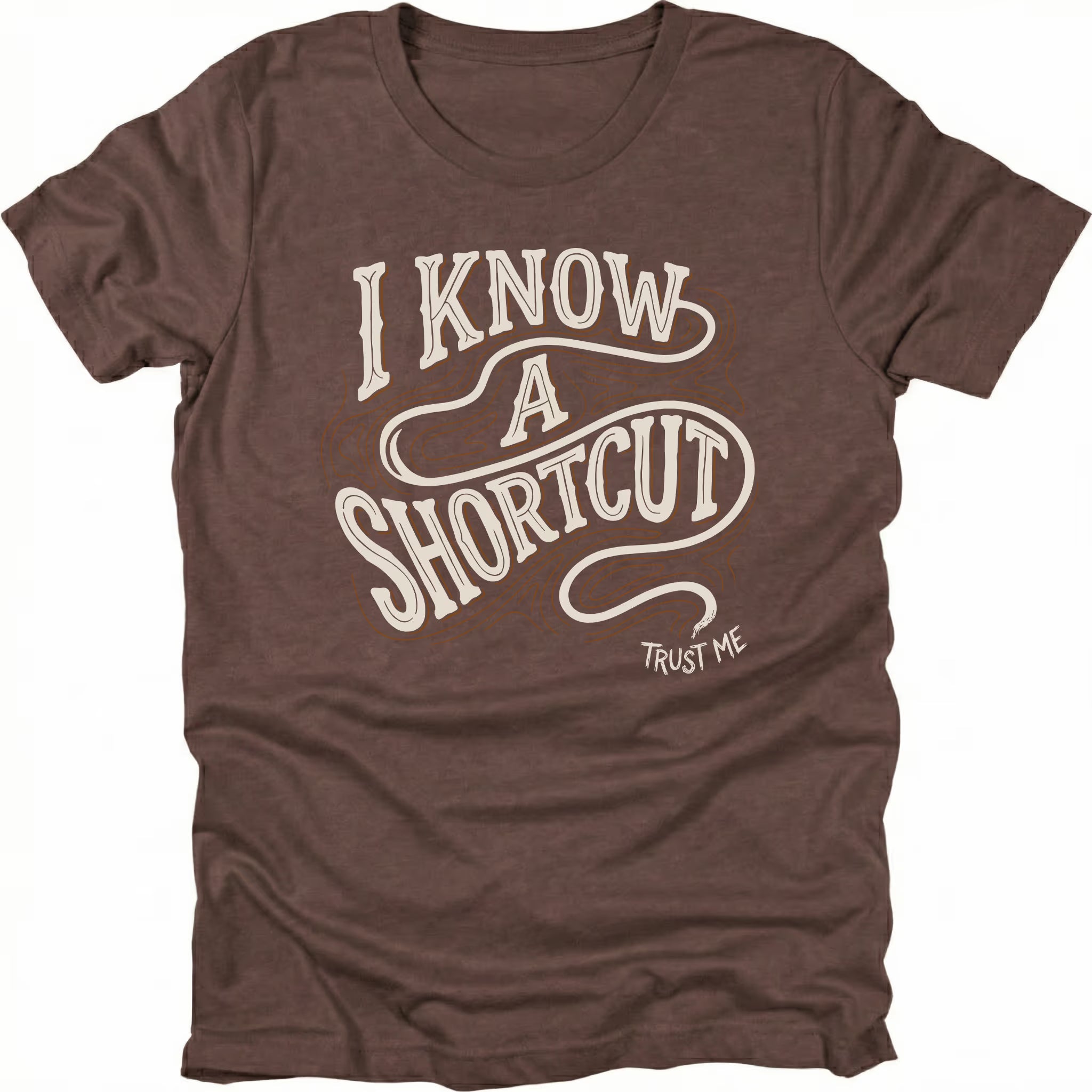 Espresso t-shirt with vintage typography reading I Know A Shortcut Trust Me with winding trail lines, front view by Trail Snark.