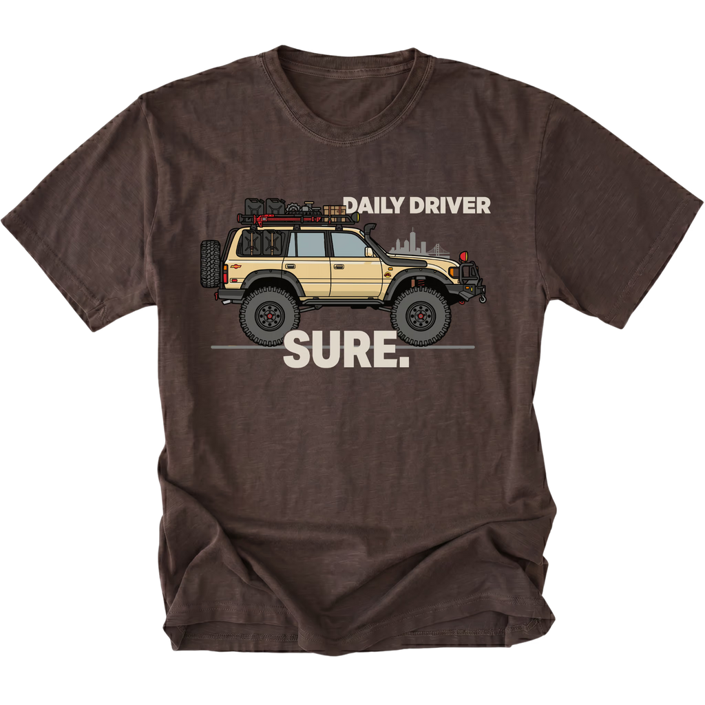Espresso t-shirt featuring a built off-road vehicle with daily driver sure text graphic shown from the front by Trail Snark.
