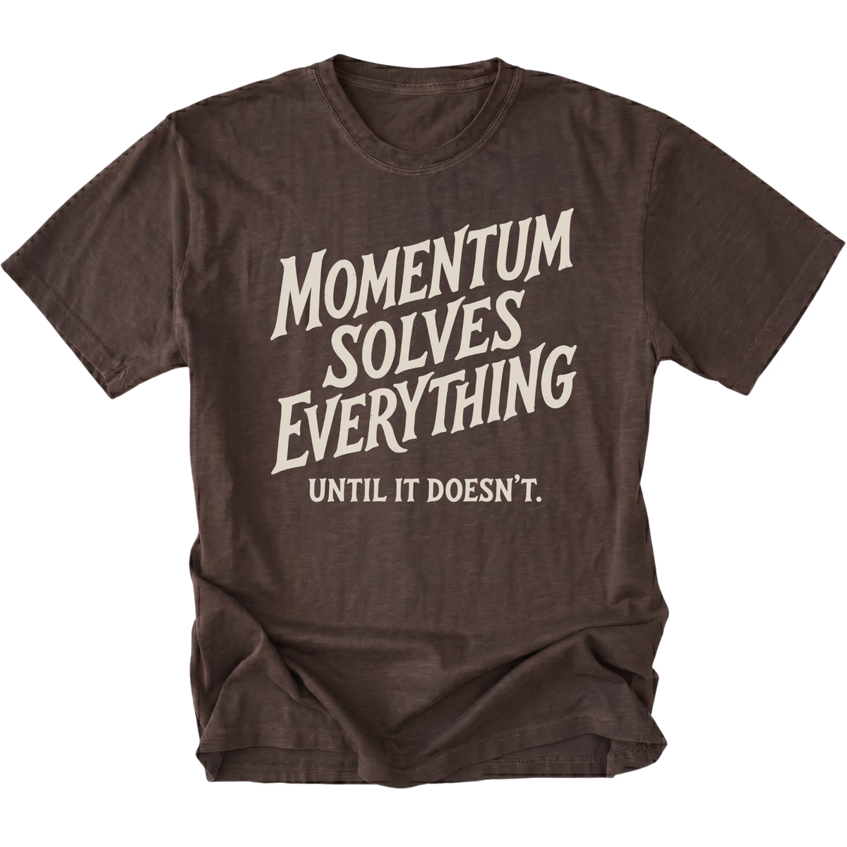 A dark brown short-sleeve t-shirt with a distressed cream-colored graphic text that reads 'MOMENTUM SOLVES EVERYTHING UNTIL IT DOESN'T.' on a solid white background.
