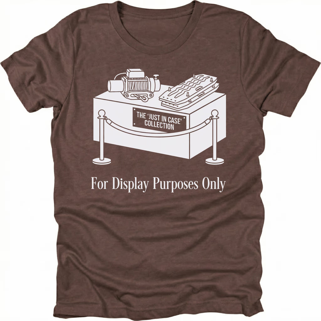 Espresso t-shirt featuring a display stand graphic labeled the just in case collection with off-road gear and for display purposes only text shown from the front.