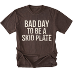Espresso t-shirt featuring bold bad day to be a skid plate text graphic shown from the front by Trail Snark.