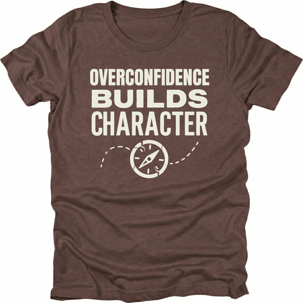 Espresso T-Shirt with “Overconfidence Builds Character” text and compass graphic shown on front view by Trail Snark.