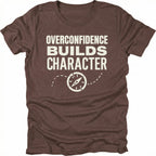 Espresso T-Shirt with “Overconfidence Builds Character” text and compass graphic shown on front view by Trail Snark.