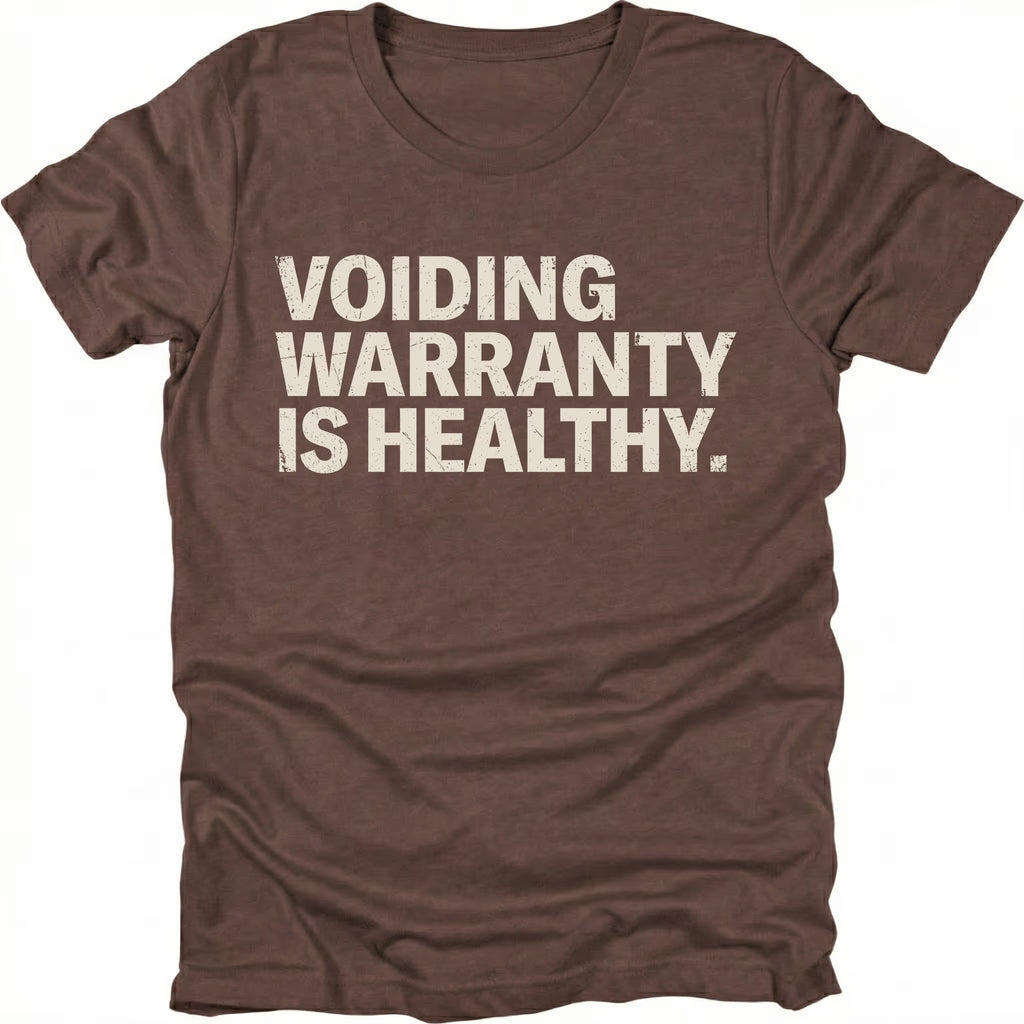 Espresso t-shirt with bold text reading “Voiding Warranty Is Healthy” printed on the front.