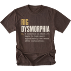 A dark brown short-sleeve t-shirt with a humorous graphic print on the front. The text reads 'RIG DYSMORPHIA' in gold and white, followed by a definition in white typewriter font.