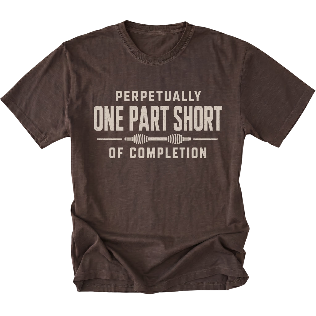 Espresso T-shirt with a Perpetually One Part Short Of Completion garage build design shown from the front by Trail Snark.