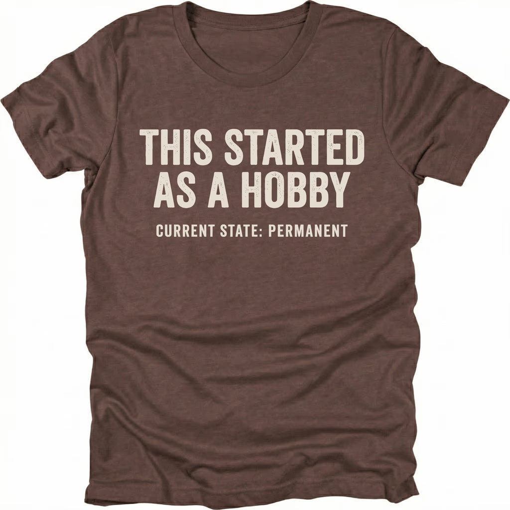 Espresso t-shirt with text reading “This Started As a Hobby – Current State: Permanent” displayed on the front.