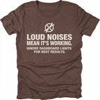 Espresso t-shirt with wrench icon and text reading Loud Noises Mean It’s Working Ignore Dashboard Lights for Best Results, front view by Trail Snark.