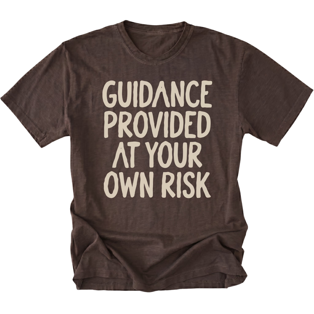 An dark brown t-shirt featuring the text 'GUIDANCE PROVIDED AT YOUR OWN RISK'.