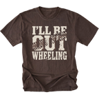 A dark brown short-sleeve t-shirt with a distressed cream graphic on the front that reads 'I'LL BE OUT WHEELING' with tire tracks integrated into the letters, shown on a plain white background.