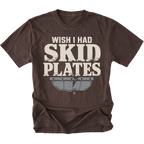 An espresso brown short-sleeve t-shirt with a distressed graphic that reads 'WISH I HAD SKID PLATES' in cream lettering above a gray metallic bumper graphic, shown on a plain white background.