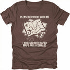 Espresso T-Shirt with paper map and compass graphic reading “Please Be Patient With Me I Wheeled With Paper Maps And A Compass” shown on front view by Trail Snark.