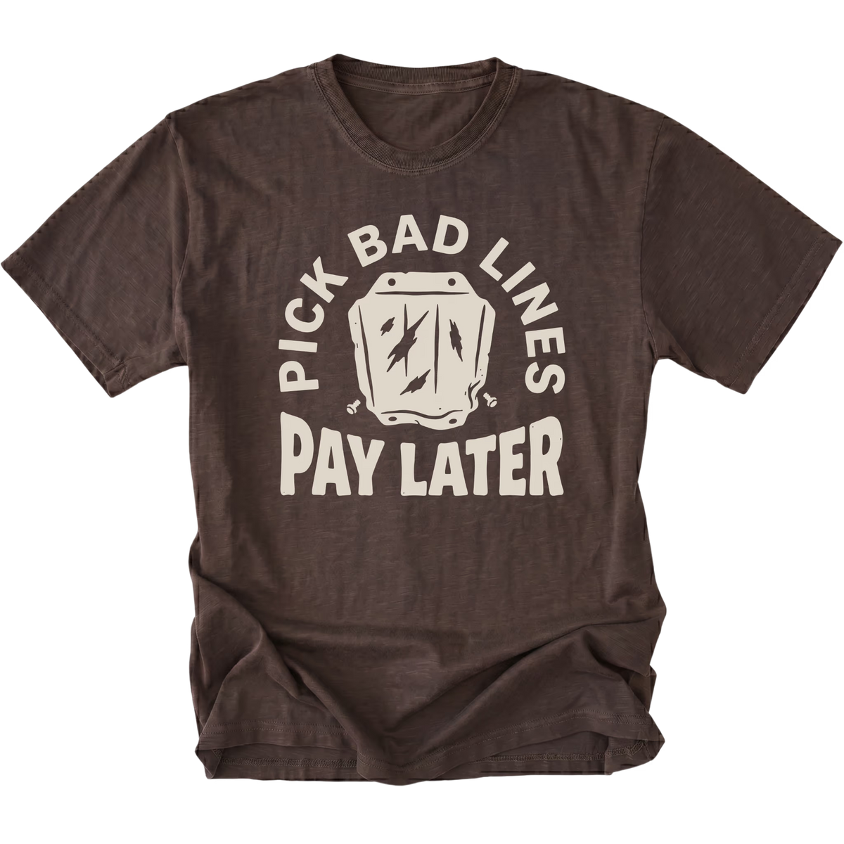 A dark brown short-sleeve t-shirt with a distressed graphic on the front that reads 'PICK BAD LINES PAY LATER' in cream-colored lettering around a small illustrated wallet with lightning bolts.