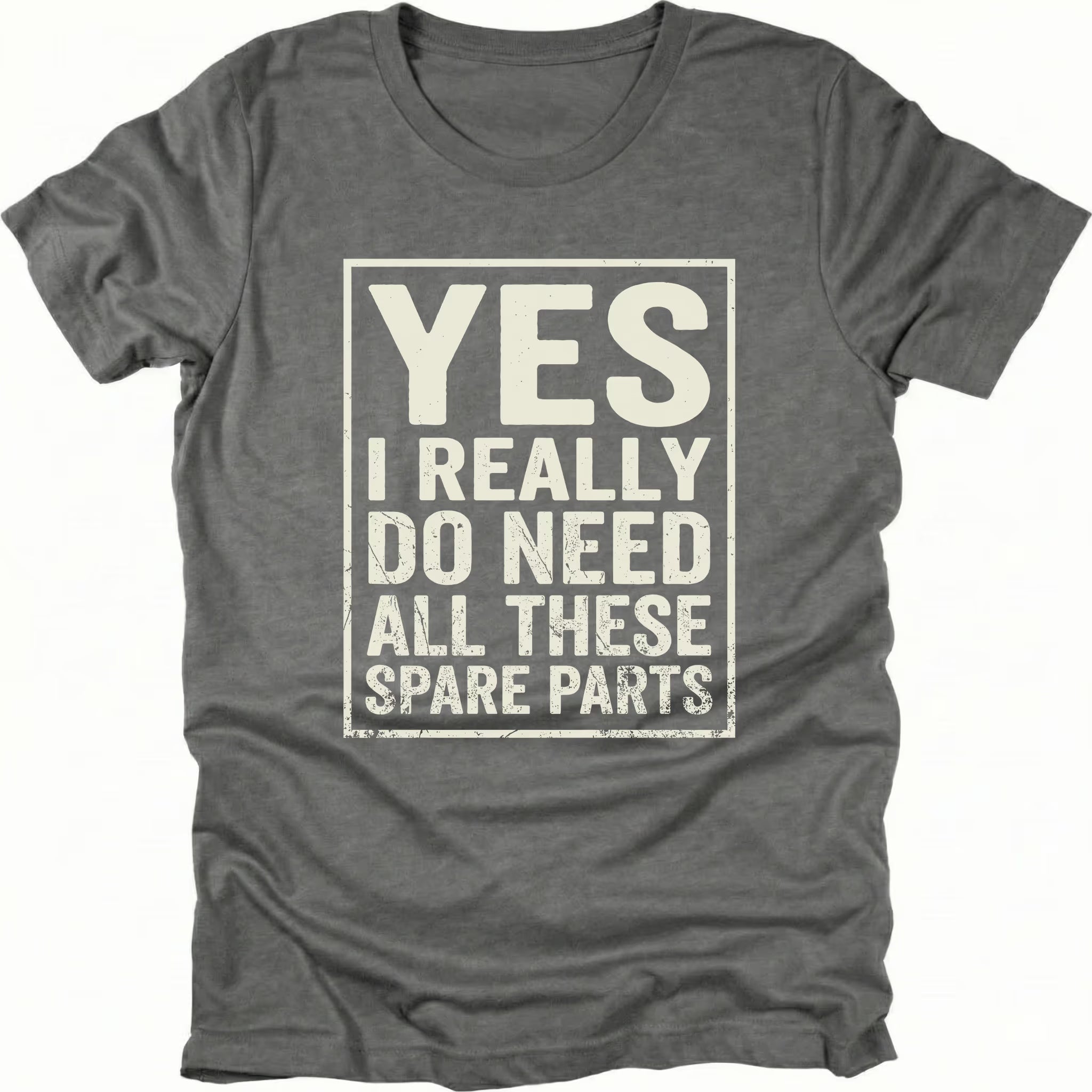 Grey t-shirt with bold distressed text reading “Yes I Really Do Need All These Spare Parts” in a boxed layout on the front by Trail Snark.