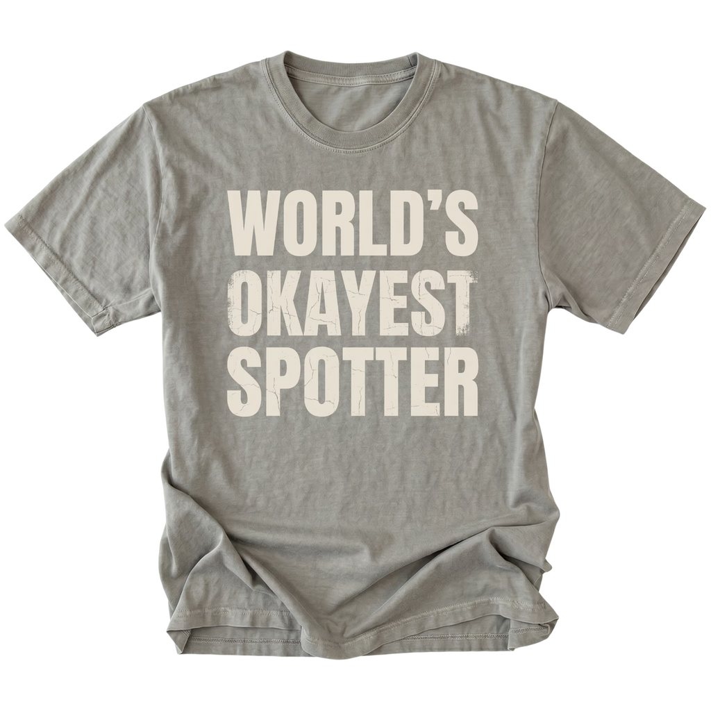 Grey t-shirt with bold distressed text reading “World’s Okayest Spotter.”