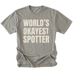 Grey t-shirt with bold distressed text reading “World’s Okayest Spotter.”