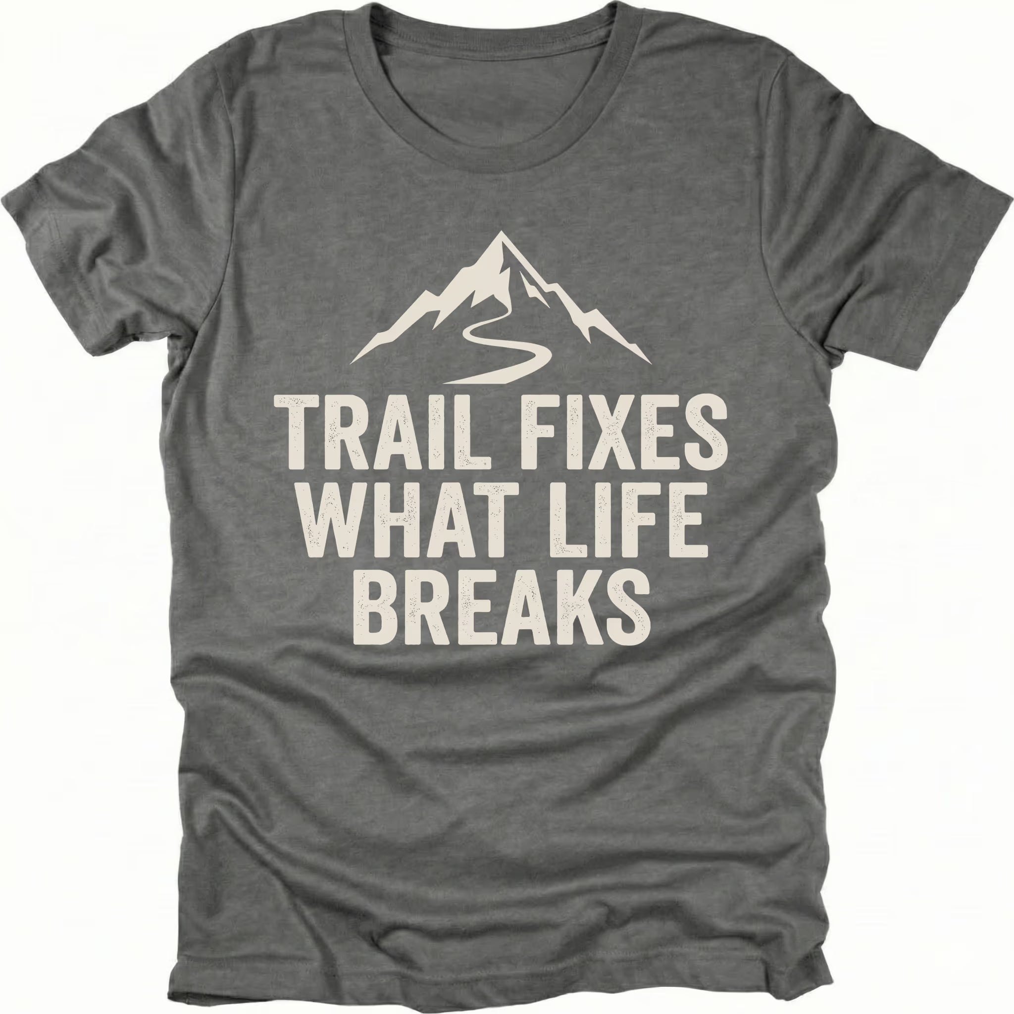 Grey t-shirt with the phrase “Trail Fixes What Life Breaks” beneath a mountain and winding trail graphic printed on the front.