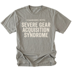 Grey t-shirt featuring diagnosed with severe gear acquisition syndrome bold text graphic shown from the front by Trail Snark.