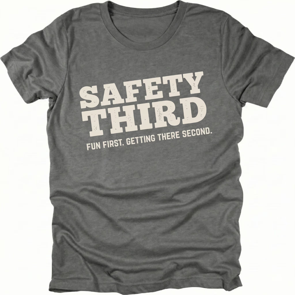 Grey T-Shirt with bold “Safety Third” text and tagline “Fun First Getting There Second” shown on front view by Trail Snark.