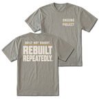 Grey T-Shirt with Ongoing Project front design and Built Not Bought Rebuilt Repeatedly back design shown by Trail Snark.