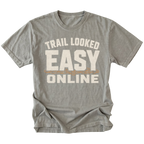 Grey T-Shirt with Trail Looked Easy Online off-road trail humor design shown from the front by Trail Snark.