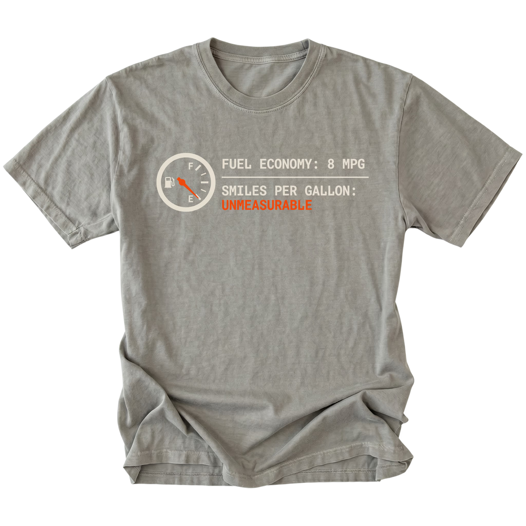 Grey t-shirt featuring a fuel gauge graphic with text reading fuel economy 8 MPG and smiles per gallon unmeasurable displayed on the front.