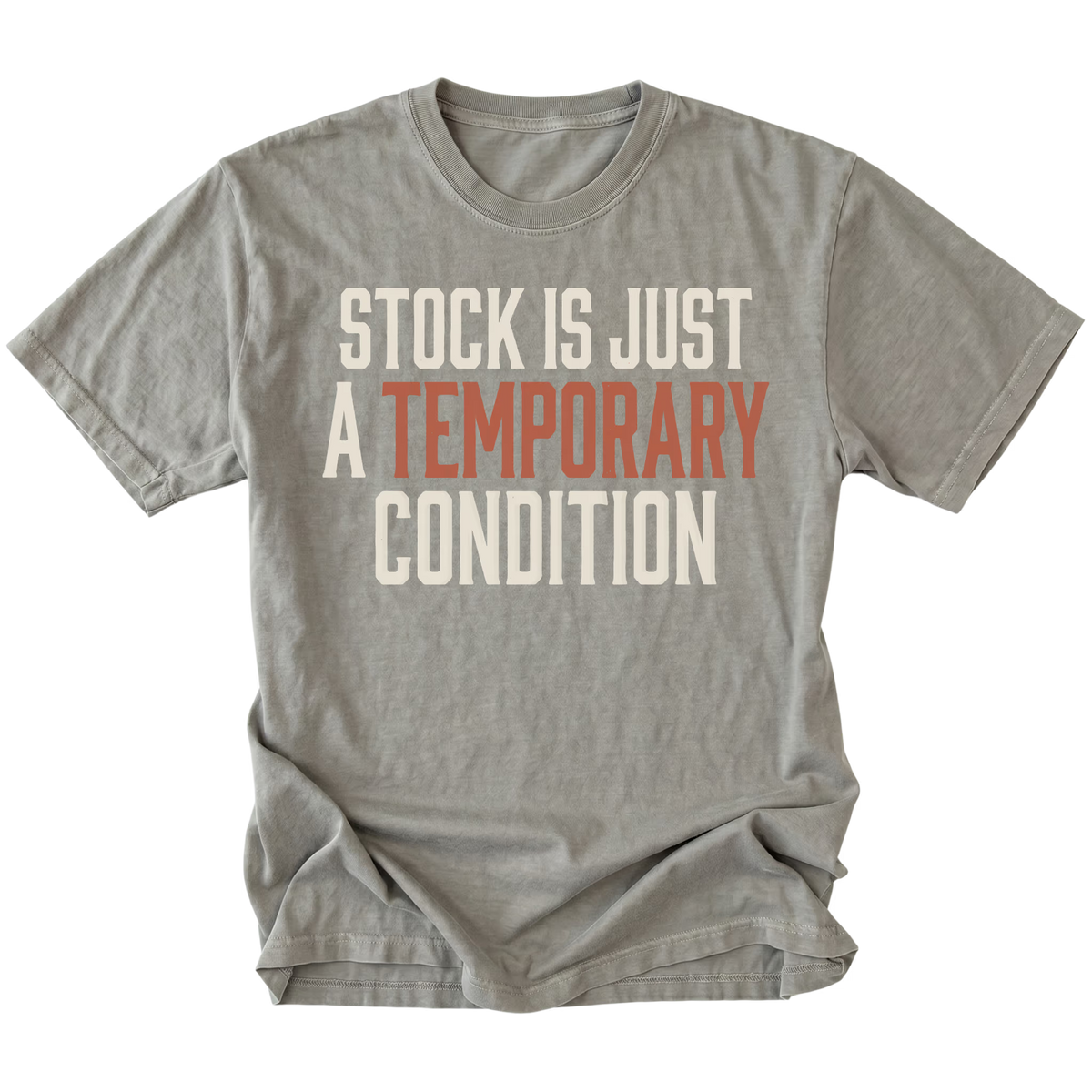 A gray short-sleeve t-shirt with a distressed graphic text print reading 'STOCK IS JUST A TEMPORARY CONDITION' in cream and muted orange-red lettering, displayed flat against a solid white background.