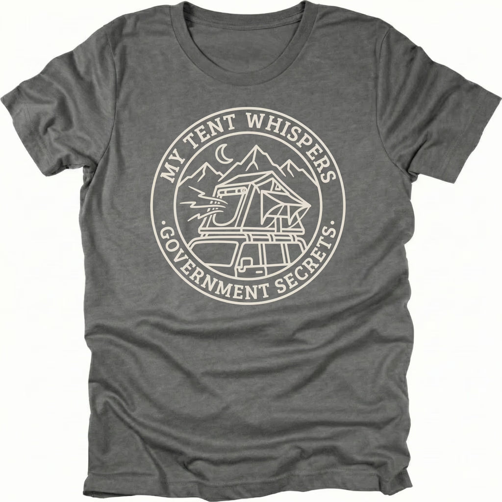 Grey t-shirt with circular white line-art badge showing a rooftop tent on a vehicle under mountains and moon with text reading My Tent Whispers Government Secrets.
