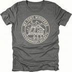 Grey t-shirt with circular white line-art badge showing a rooftop tent on a vehicle under mountains and moon with text reading My Tent Whispers Government Secrets.