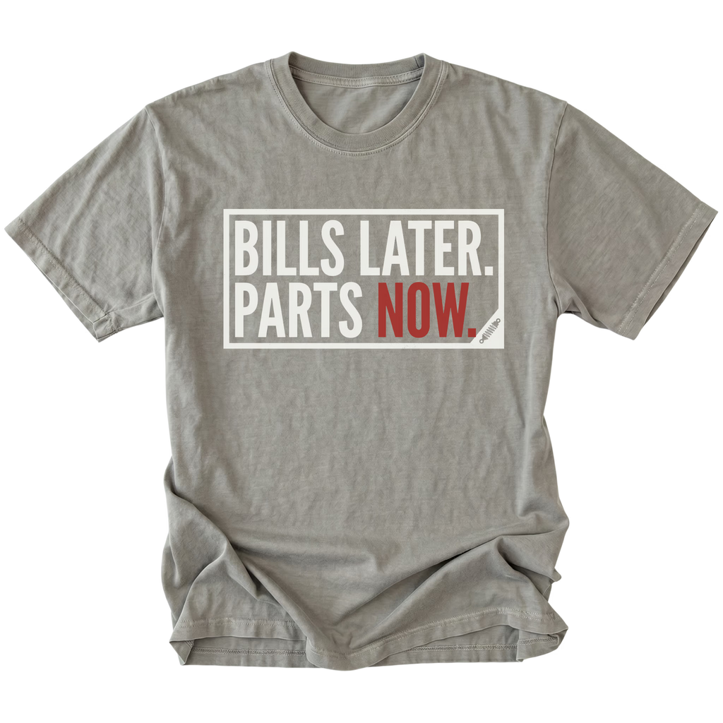 Grey t-shirt featuring Bills Later Parts Now design in bold lettering on front view by Trail Snark.