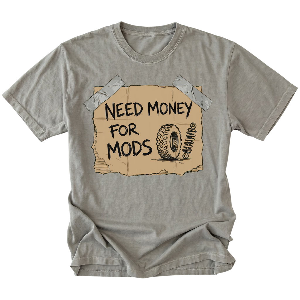 Grey t-shirt featuring a cardboard sign graphic taped at the corners with handwritten text reading Need Money For Mods and a sketch of an offroad tire and suspension.
