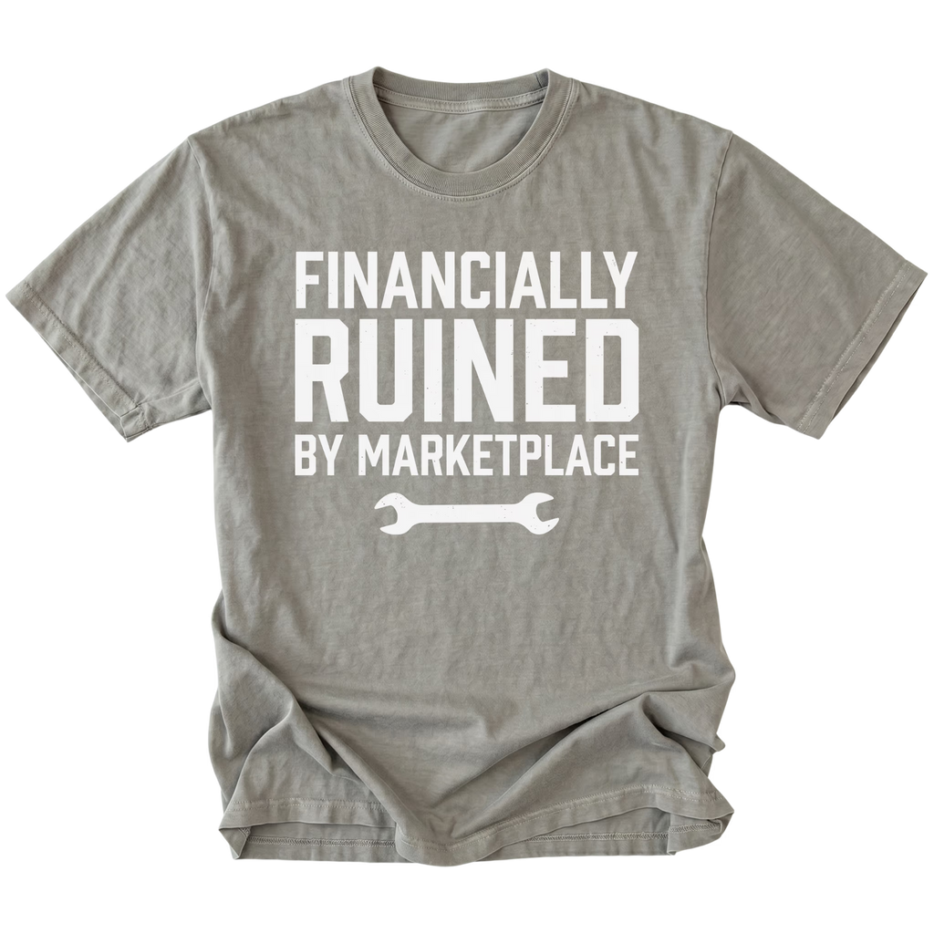 Grey t-shirt with Financially Ruined By Marketplace text and wrench graphic shown front view by Trail Snark.
