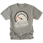 Grey t-shirt with distressed fuel gauge graphic pointing near empty and text reading My Therapist Takes Premium with Mental Health Low Fuel by Trail Snark.
