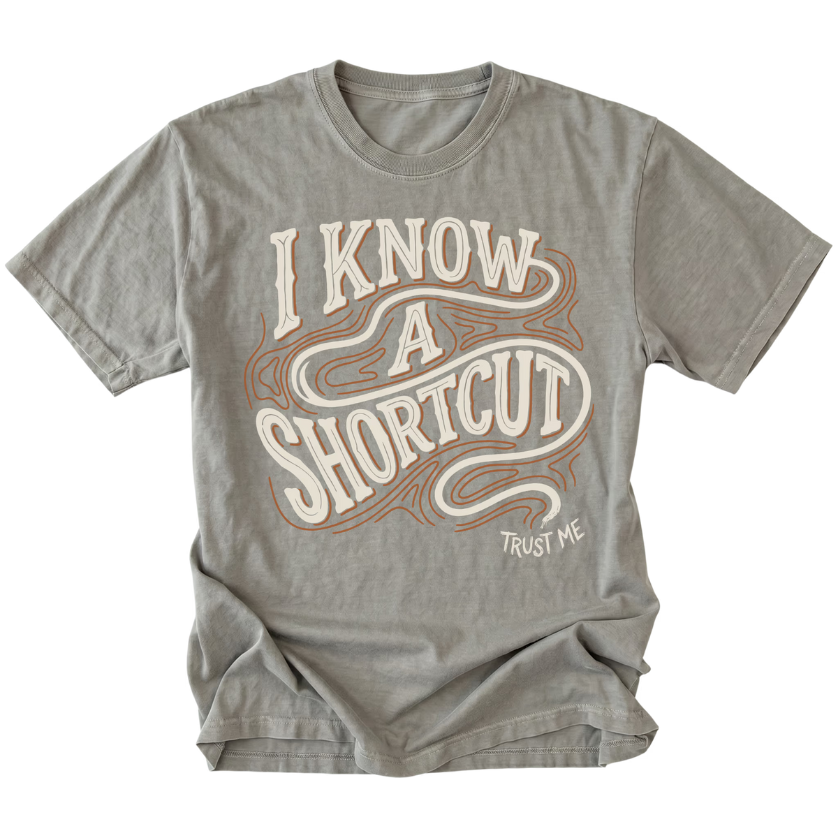 Grey T-shirt featuring the I Know a Shortcut design on the front by Trail Snark.