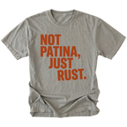 Grey t-shirt with bold rust-colored text reading Not Patina, Just Rust on the front.