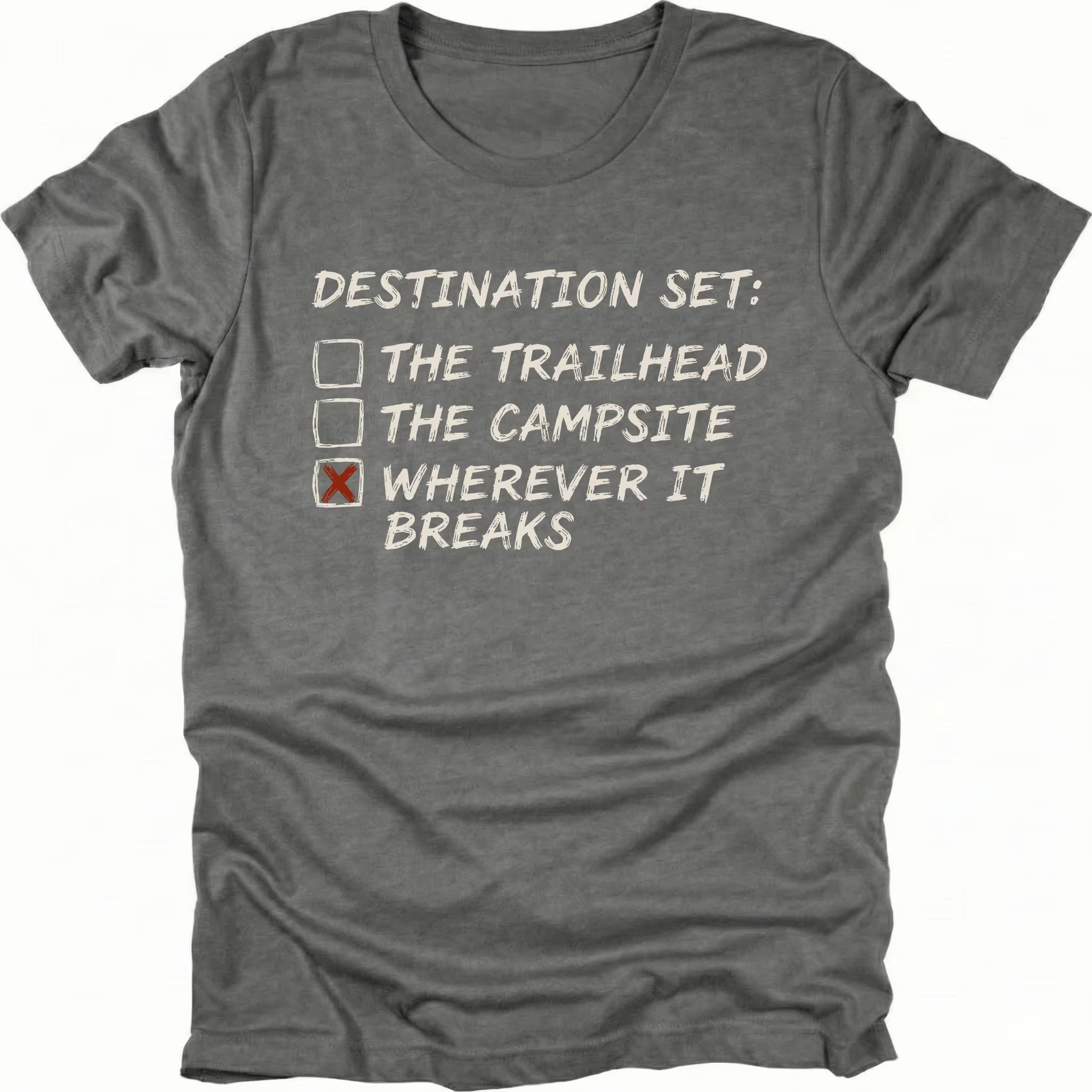 Grey t-shirt featuring destination set wherever it breaks checklist graphic shown from the front by Trail Snark.