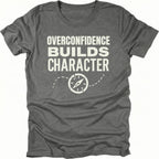 Grey T-Shirt with “Overconfidence Builds Character” text and compass graphic shown on front view by Trail Snark.