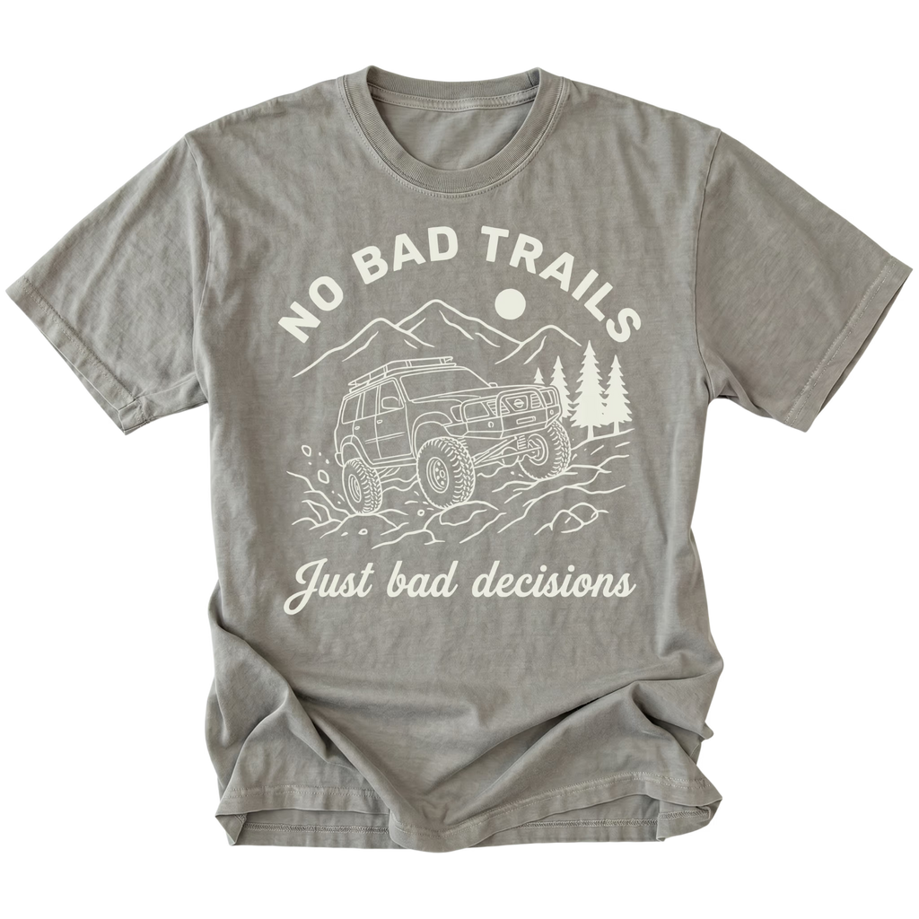 Grey t-shirt featuring an off-road SUV climbing rocks with text reading No Bad Trails Just Bad Decisions, front view by Trail Snark.