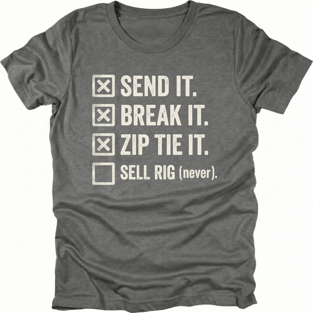 Grey T-Shirt with checklist reading “Send It Break It Zip Tie It Sell Rig Never” shown on front view by Trail Snark.