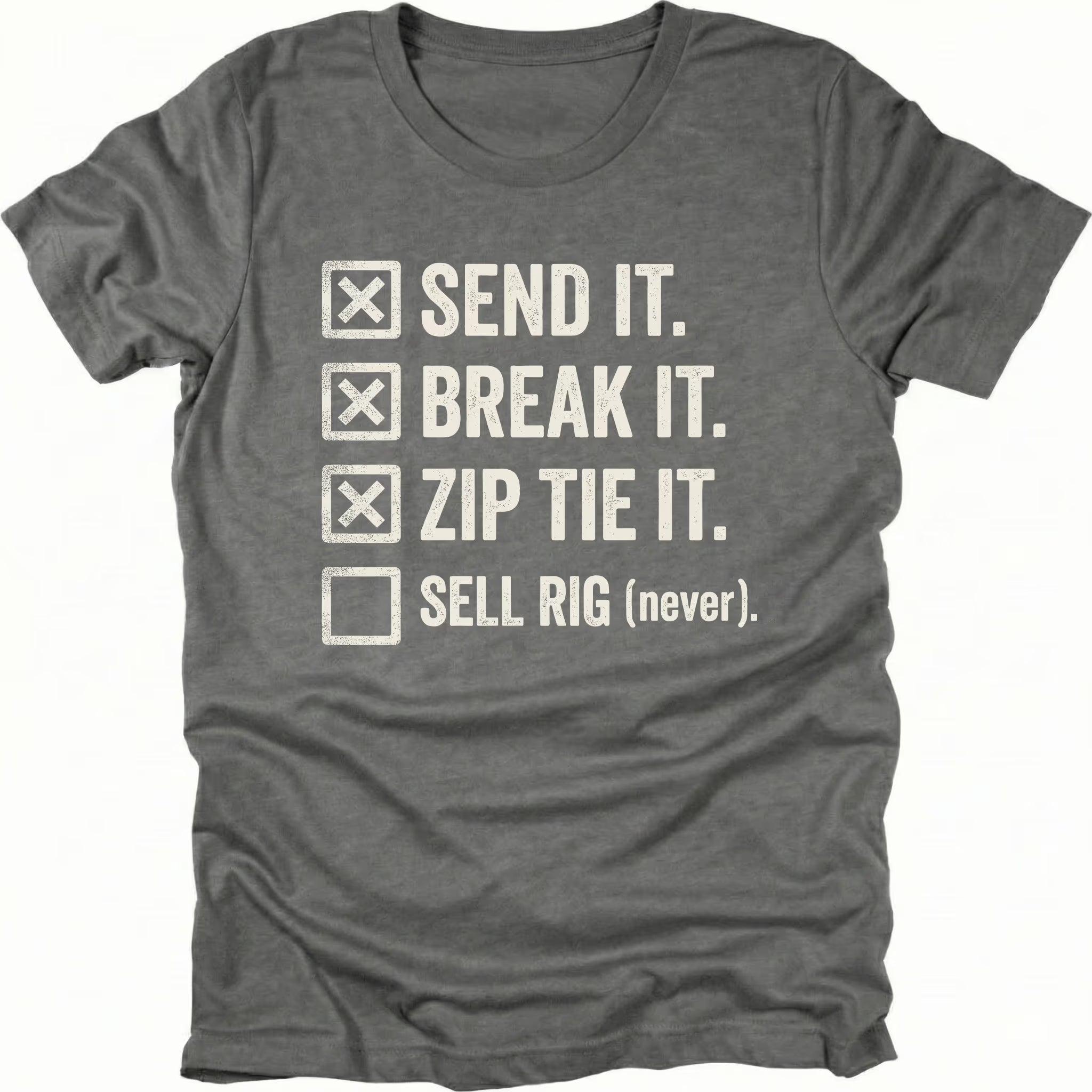Grey T-Shirt with checklist reading “Send It Break It Zip Tie It Sell Rig Never” shown on front view by Trail Snark.