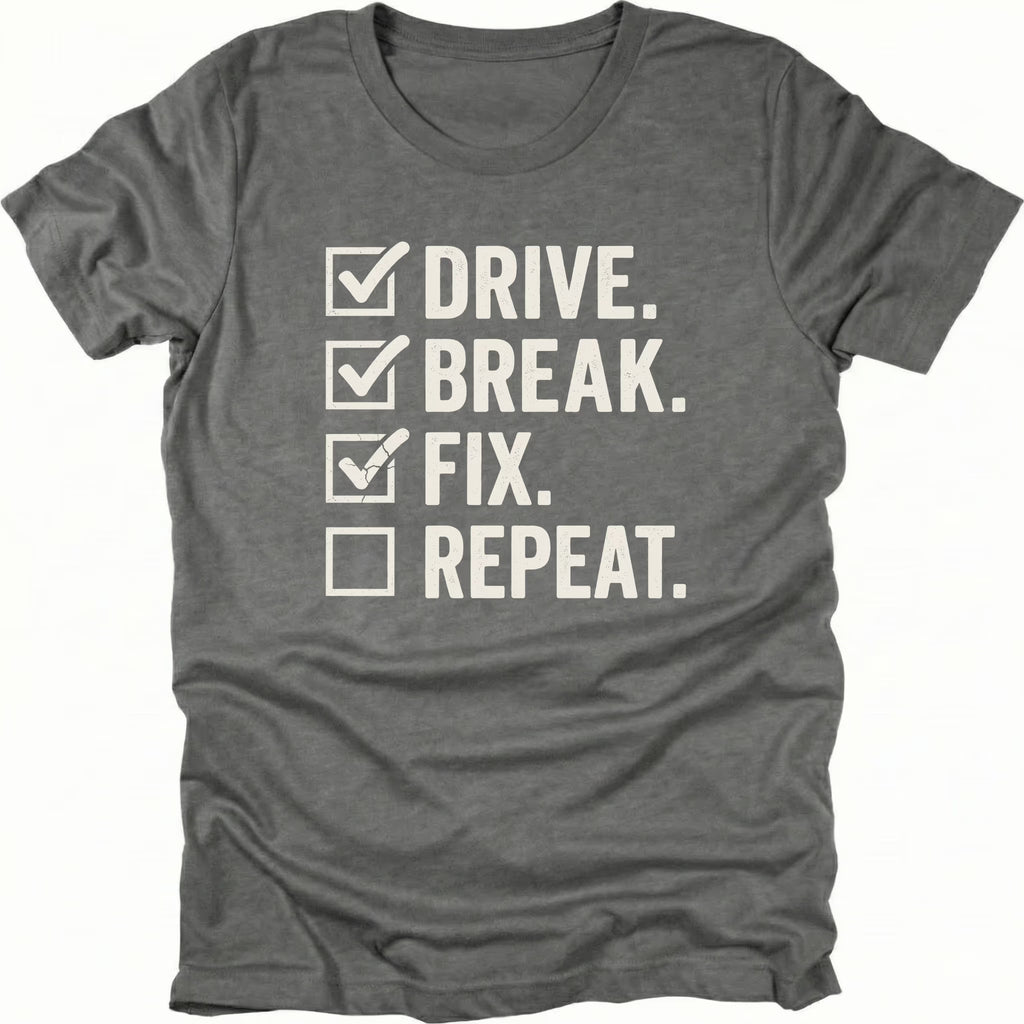 Grey t-shirt featuring drive break fix repeat checklist text graphic shown from the front by Trail Snark.