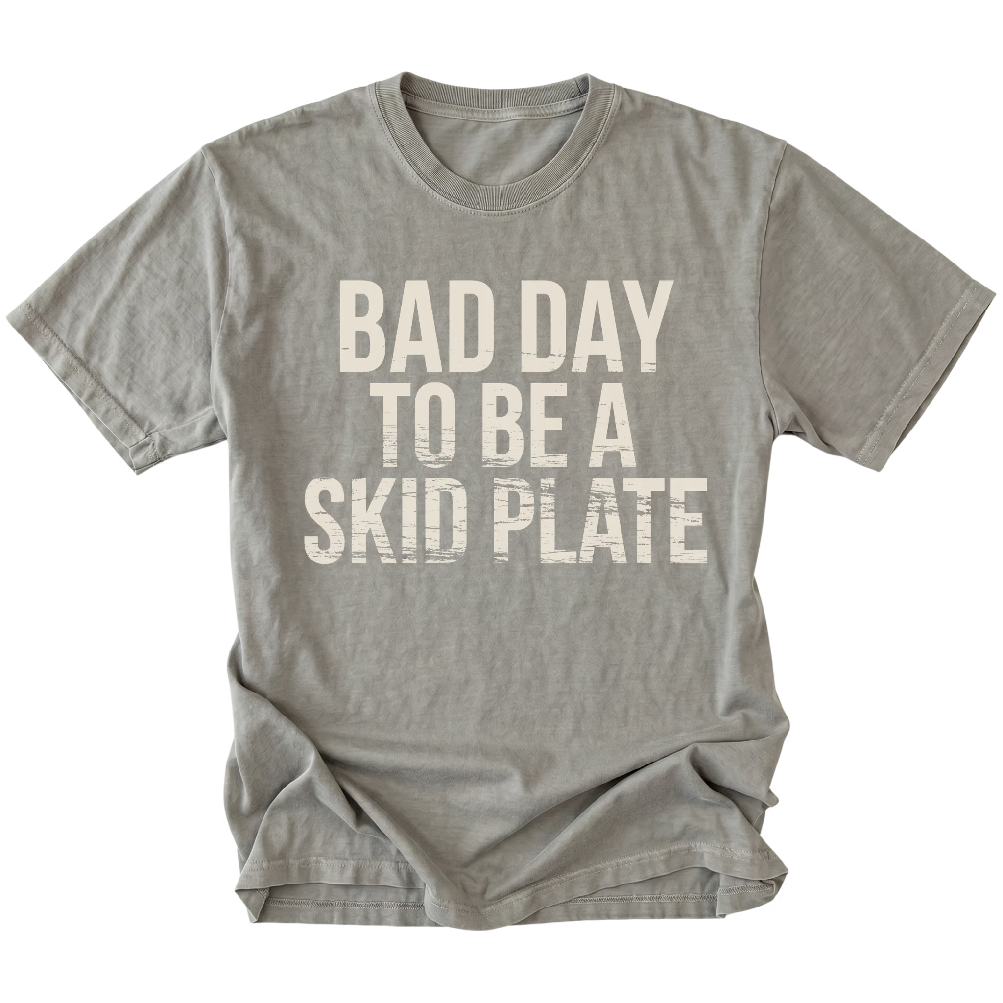 Grey t-shirt featuring bold bad day to be a skid plate text graphic shown from the front by Trail Snark.