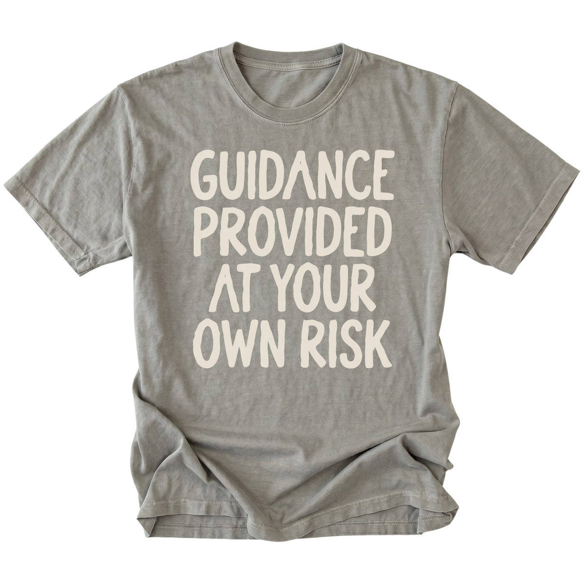 A gray t-shirt featuring the text 'GUIDANCE PROVIDED AT YOUR OWN RISK'.